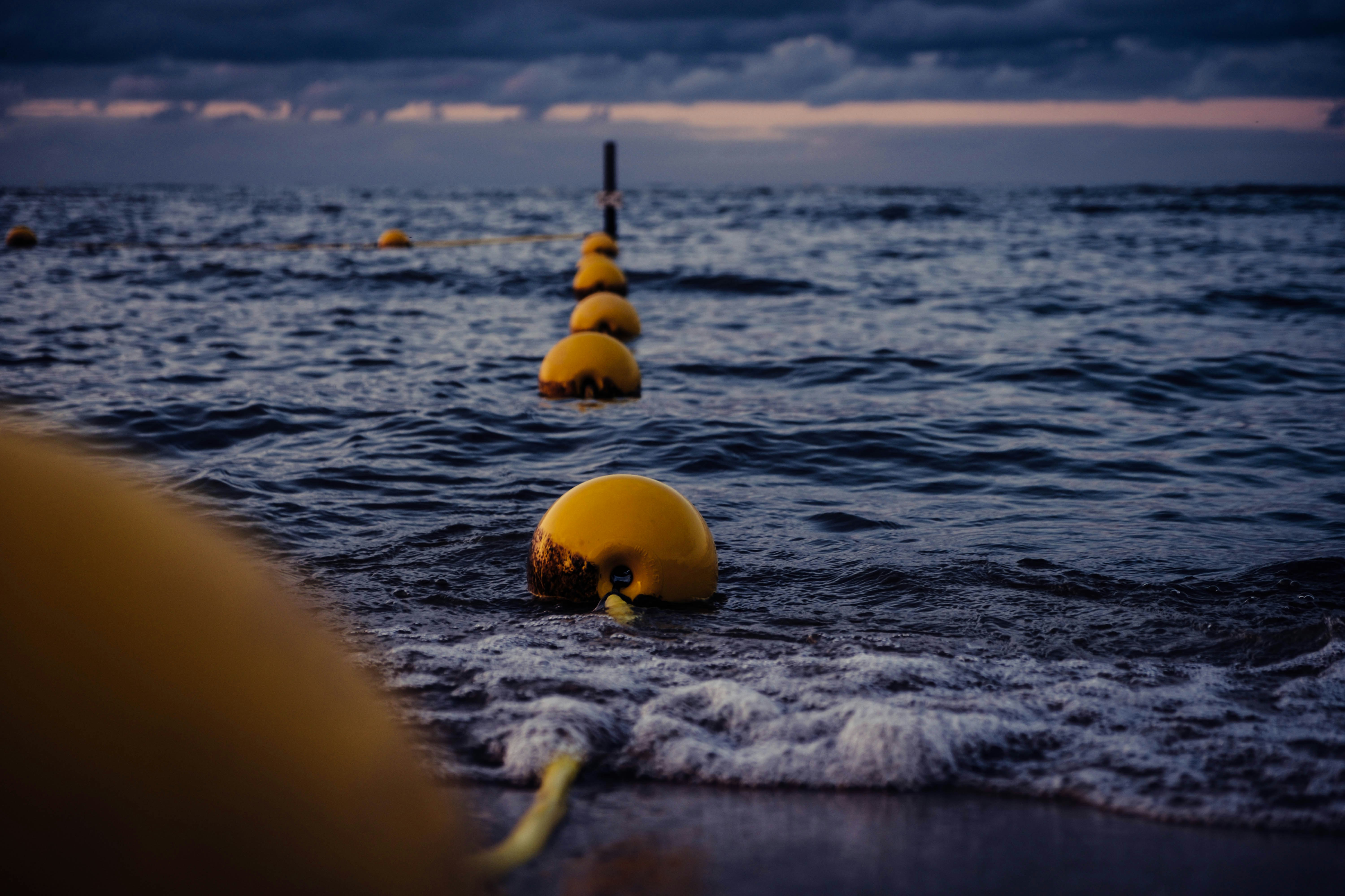 yellow balls on blue sea